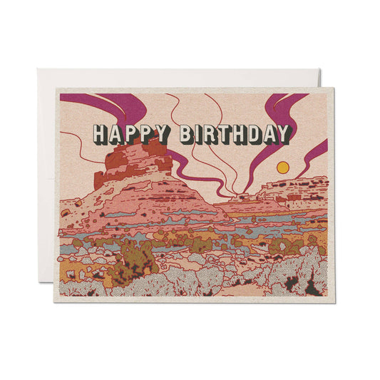 Birthday card with halftone print desert landscape design and 'Happy Birthday' text